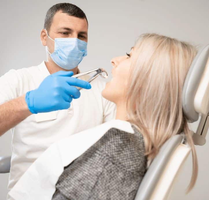 dentist removing wisdom teeth