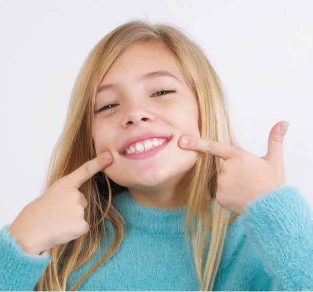 girl showing her teeth