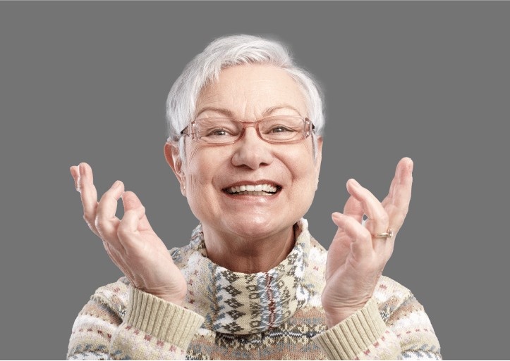 happy old lady after dental implants treatment