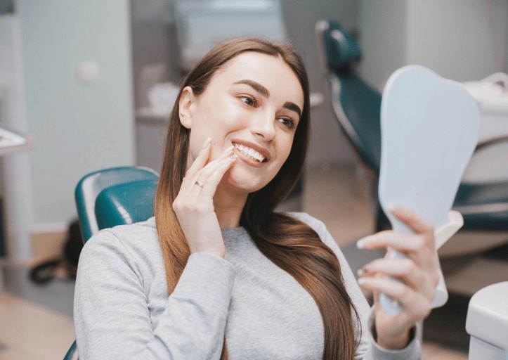 after treatment women looking at mirror